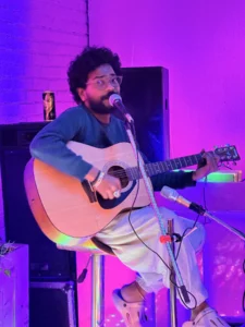 Live music cafe in Rishikesh with a musician performing at Pink Cafe